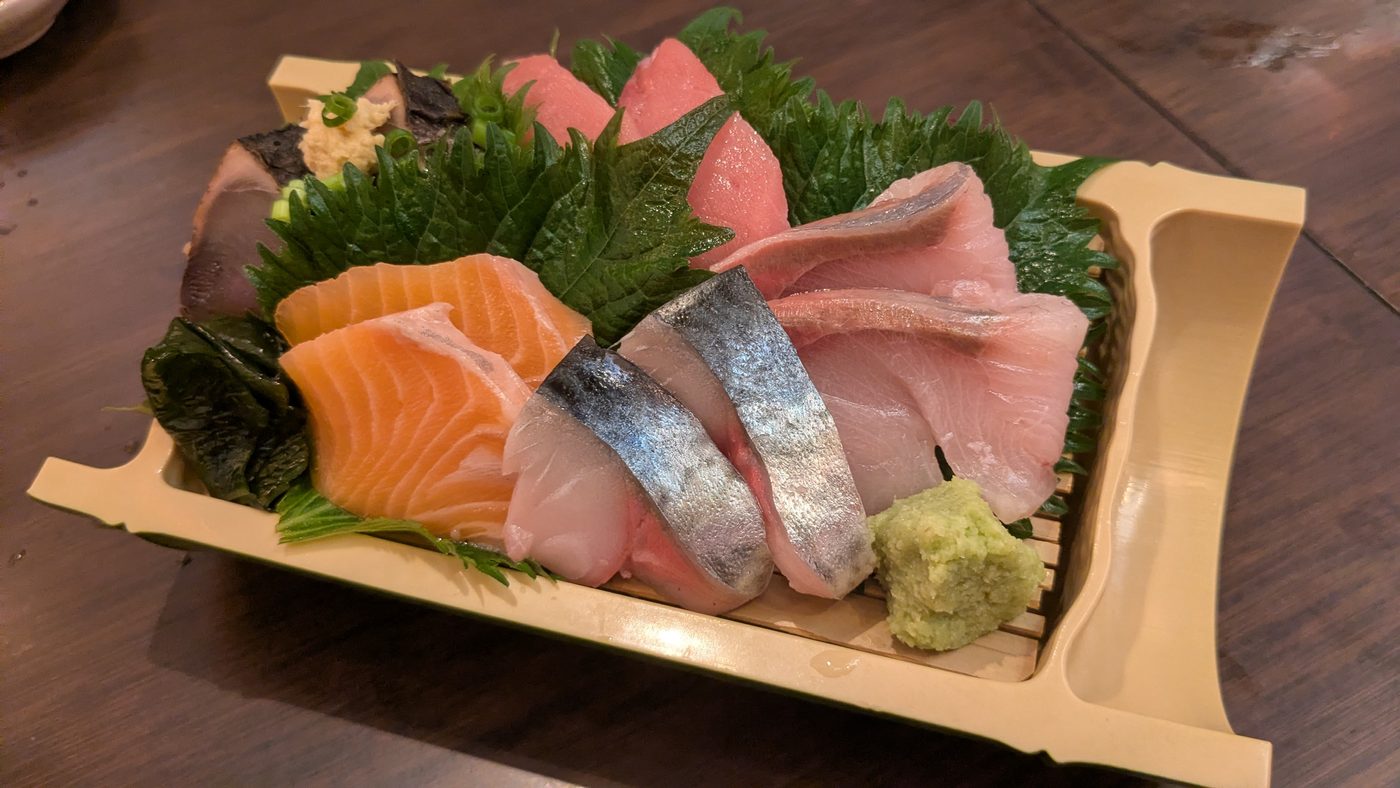 Assorted sashimi on a wooden boat